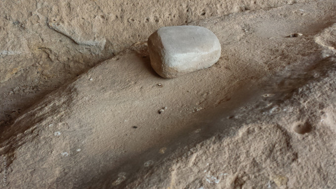 An original mortar and pestel underneath Mega Roof in Roy. SO COOL. Look, touch, but never take- there's juju at stake.